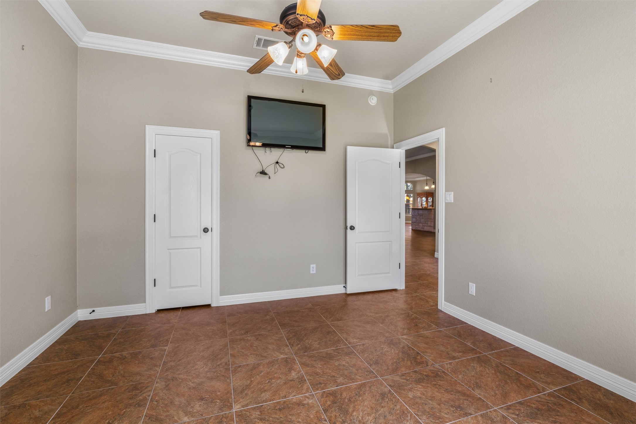 8006 Ridgeway Court Nolanville, TX 76559 - Photo 29 of 40 Unfurnished bedroom featuring ornamental molding and a ceiling fan