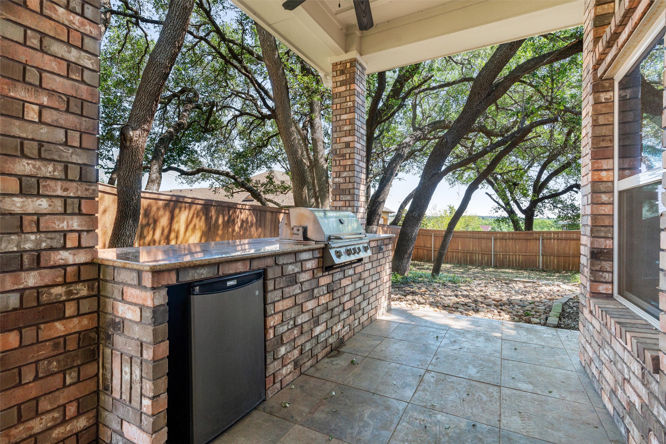 8006 Ridgeway Court Nolanville, TX 76559 - Photo 38 of 40 Fenced backyard featuring a patio and an outdoor kitchen