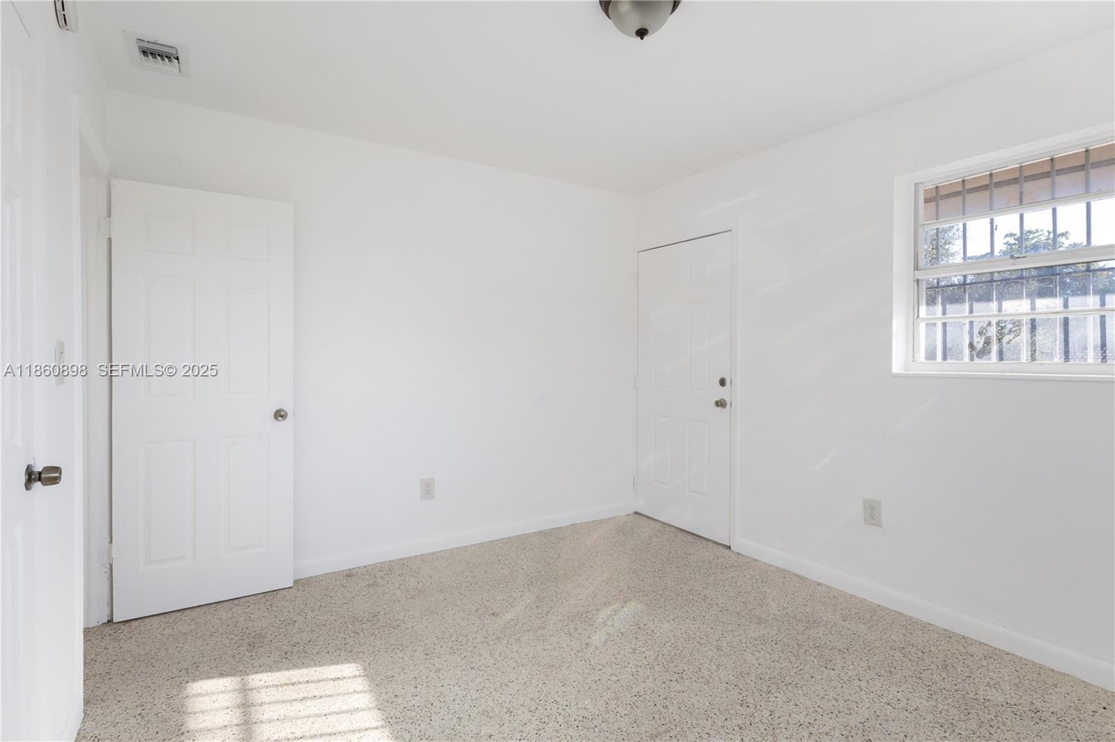 1251 Northwest 59th Street, Unit 3 Miami, FL 33142 - Photo 13 of 22 a view of an empty room