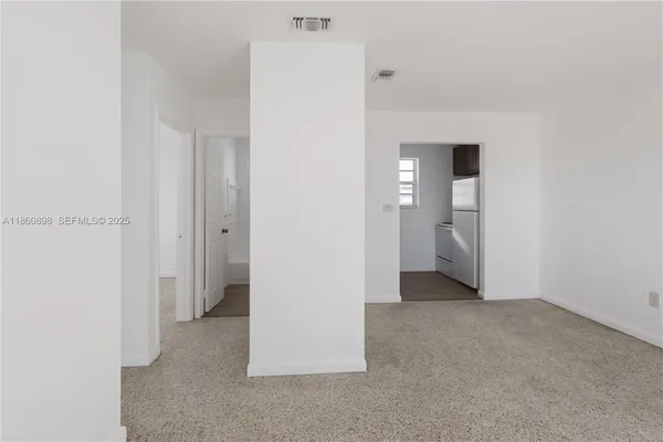 an empty room with a bathroom