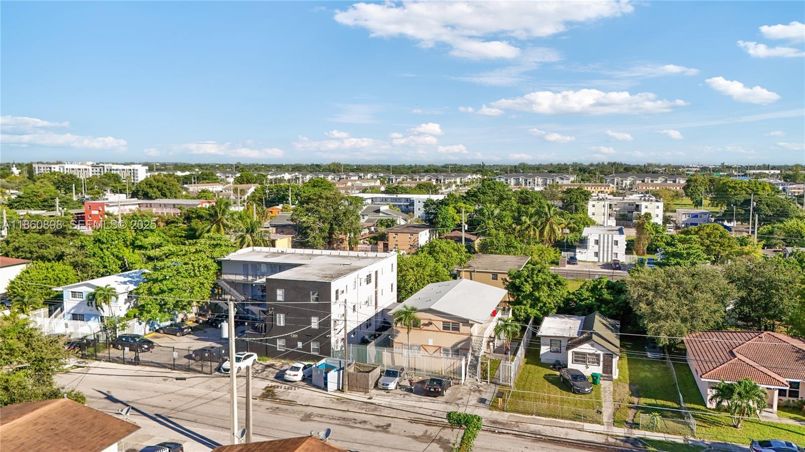 1251 Northwest 59th Street, Unit 3 Miami, FL 33142 - Photo 17 of 22 an aerial view of multiple house
