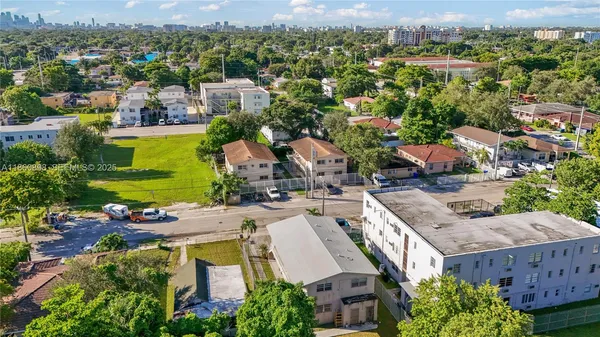 an aerial view of a house with a garden