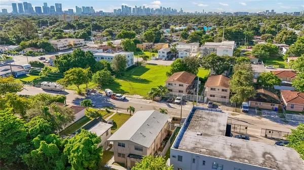 an aerial view of a house with a yard lake view