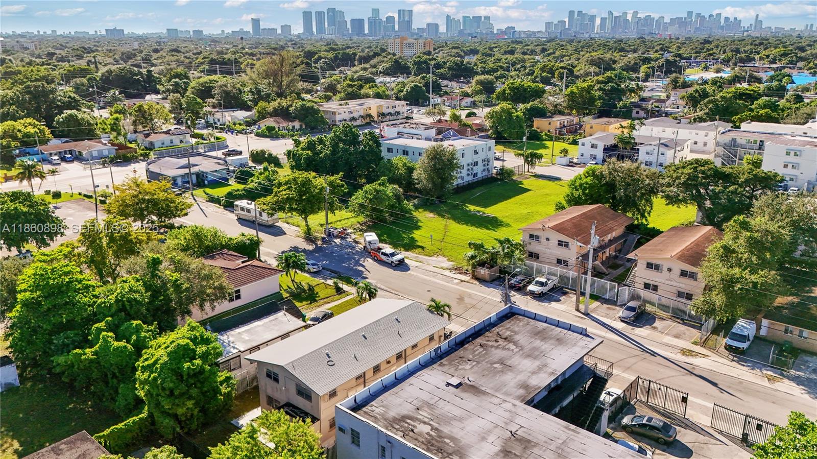 1251 Northwest 59th Street, Unit 3 Miami, FL 33142 - Photo 20 of 22 an aerial view of a house with a lake view