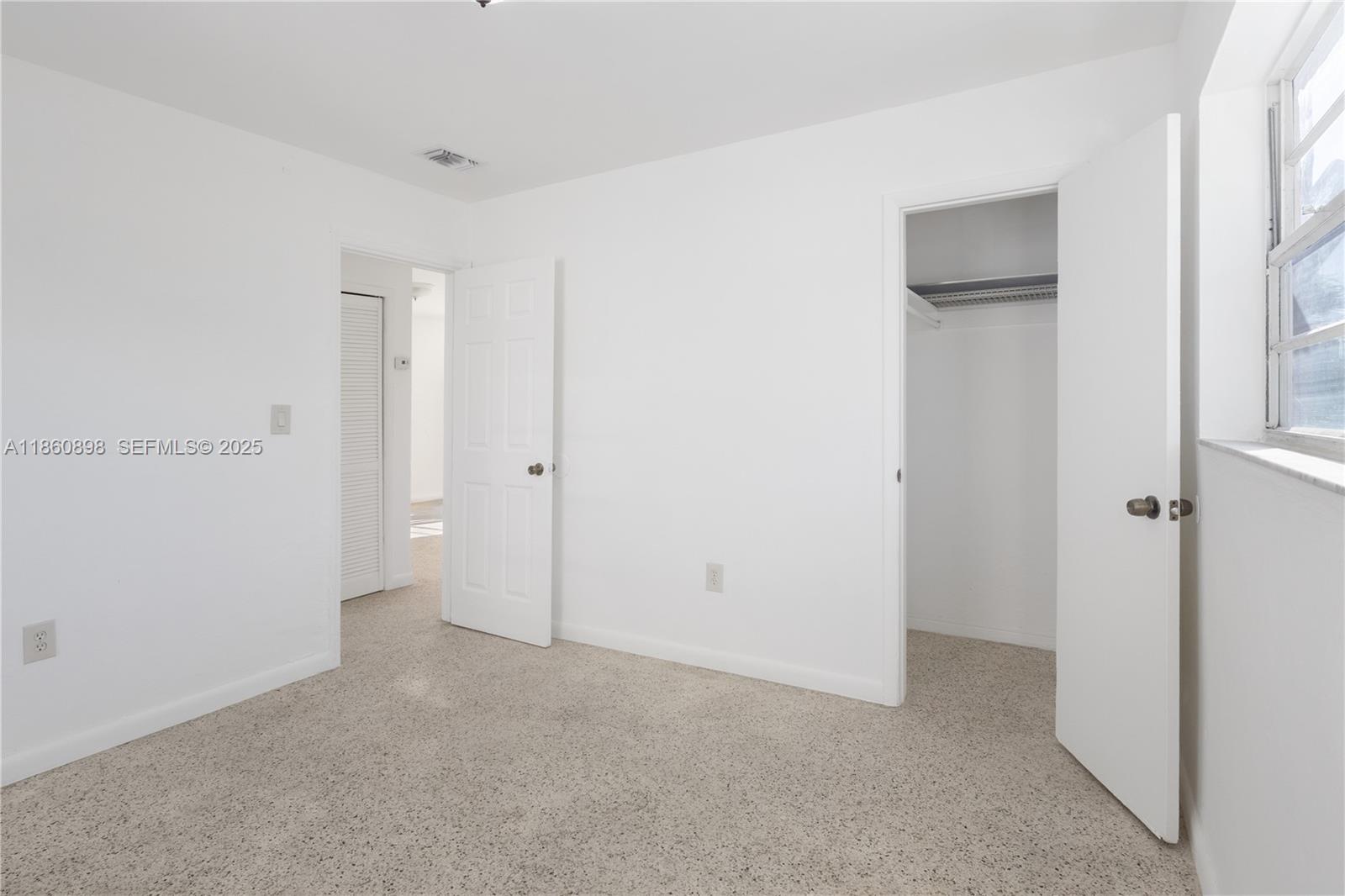 1251 Northwest 59th Street, Unit 3 Miami, FL 33142 - Photo 9 of 22 a view of an empty room