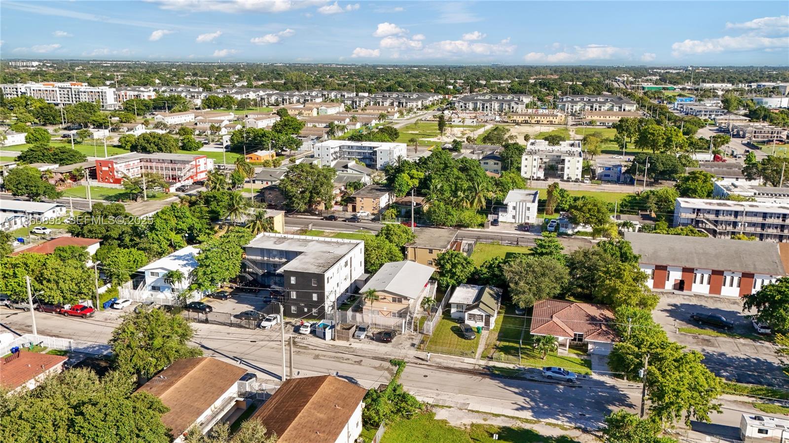 1251 Northwest 59th Street, Unit 3 Miami, FL 33142 - Photo 10 of 22 an aerial view of a city with lots of residential buildings