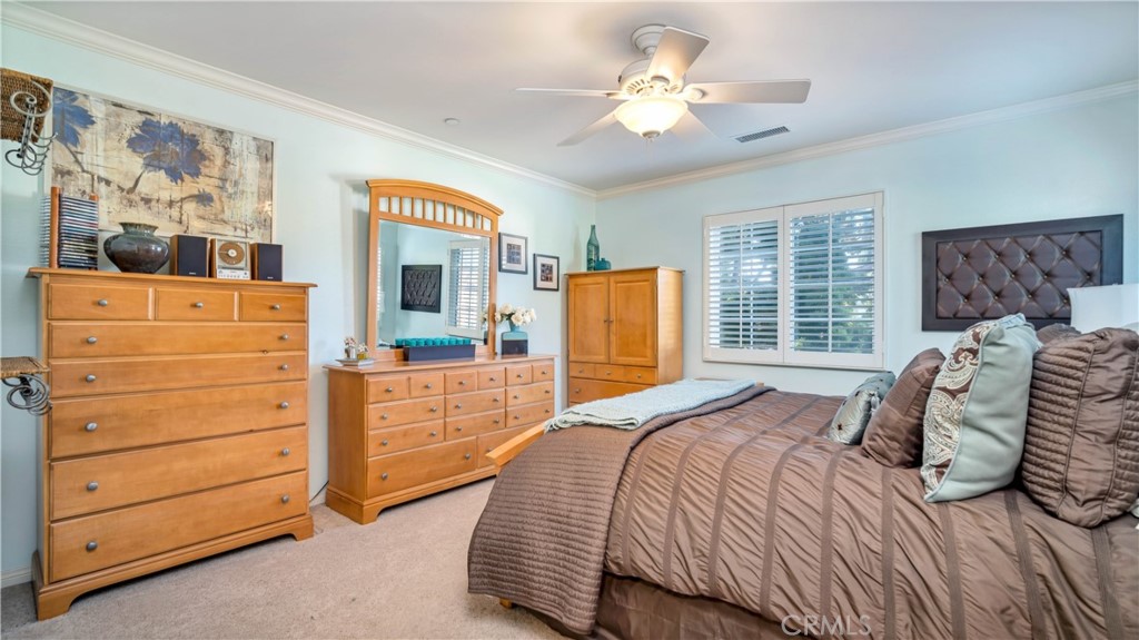 55 Bower Tree Irvine, CA 92603 - Photo 15 of 29 a bedroom with a bed and a dresser
