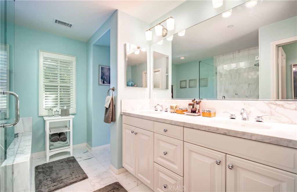 55 Bower Tree Irvine, CA 92603 - Photo 17 of 29 a bathroom with a double vanity sink mirror and bathtub