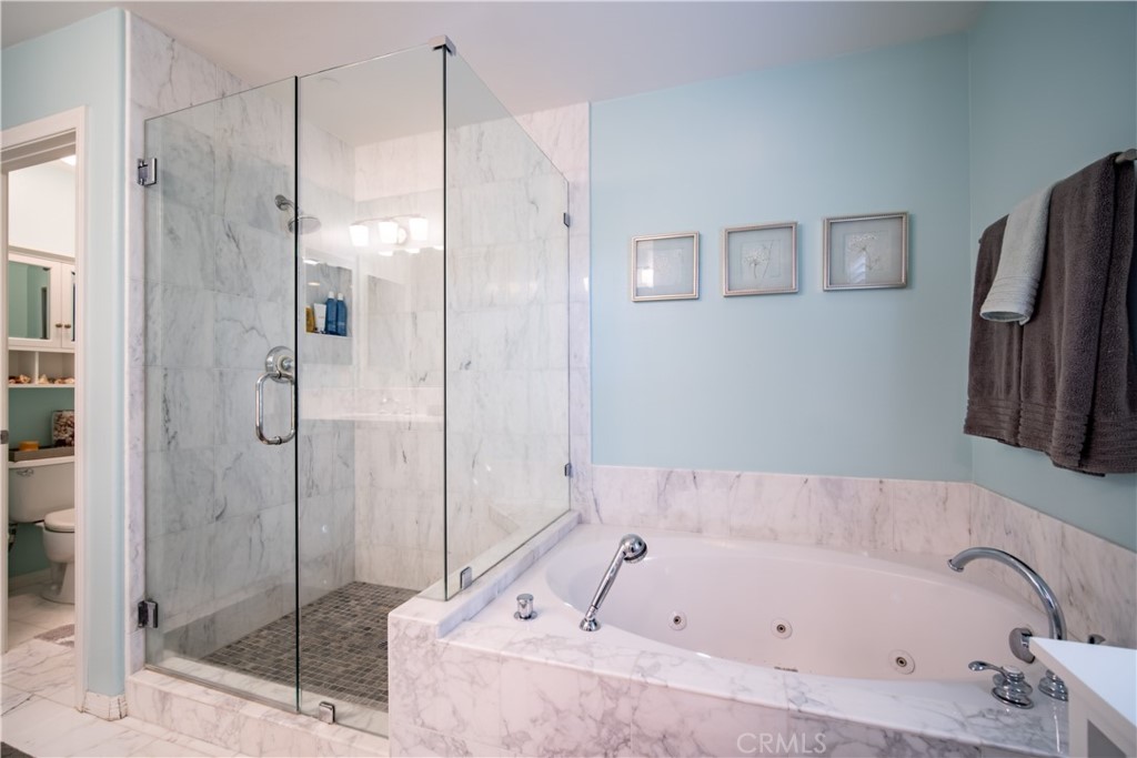 55 Bower Tree Irvine, CA 92603 - Photo 18 of 29 a bathroom with a bathtub and a shower