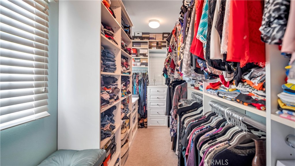 55 Bower Tree Irvine, CA 92603 - Photo 19 of 29 a view of walk in closet with clothes