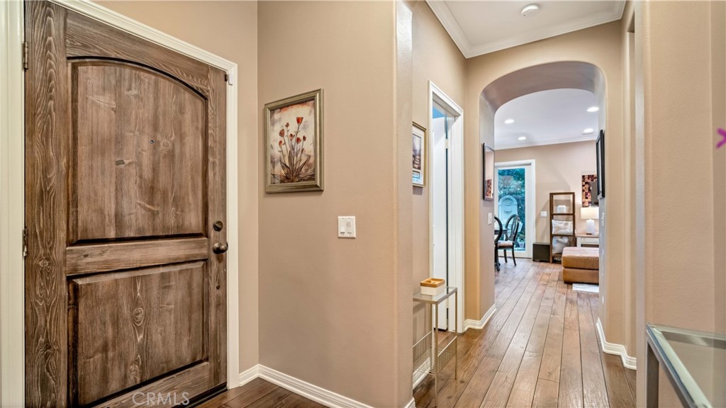 55 Bower Tree Irvine, CA 92603 - Photo 20 of 29 a view of hallway with livingroom and wooden floor