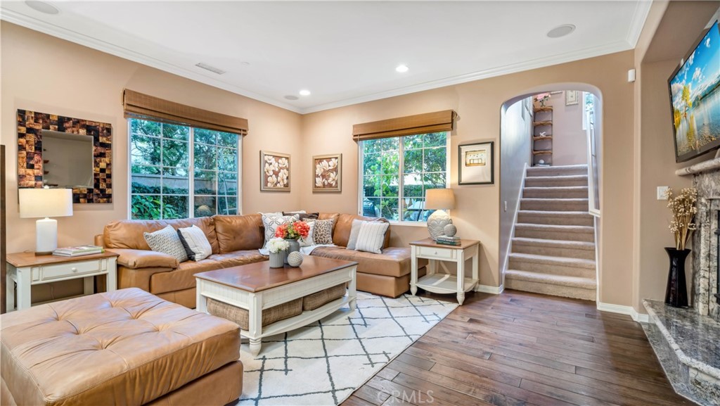 55 Bower Tree Irvine, CA 92603 - Photo 2 of 29 a living room with furniture and large windows