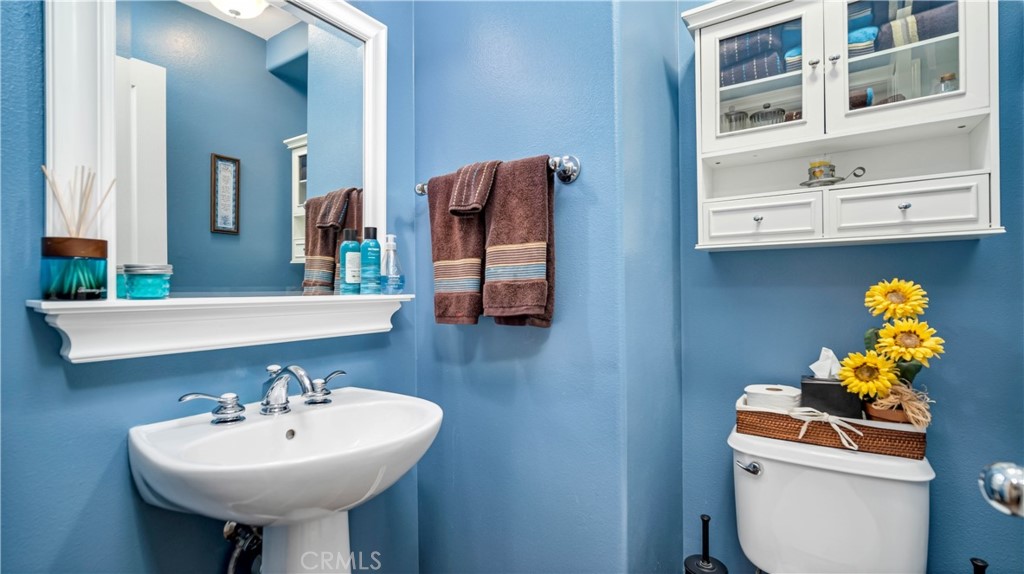 55 Bower Tree Irvine, CA 92603 - Photo 22 of 29 a bathroom with a sink mirror and toilet