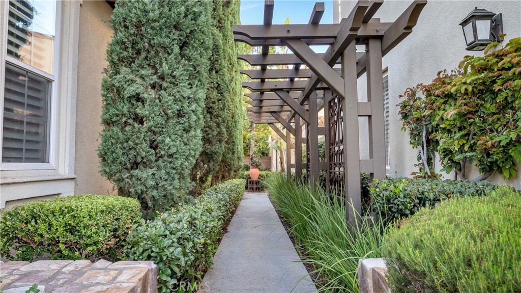 55 Bower Tree Irvine, CA 92603 - Photo 3 of 29 a view of a pathway with house on both side
