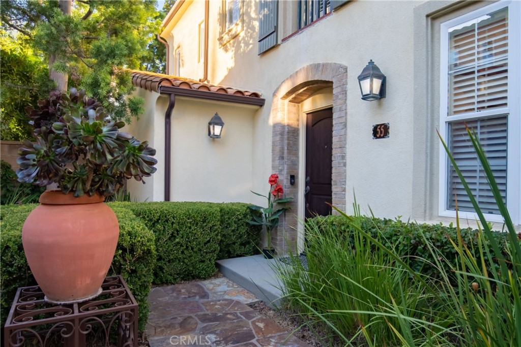 55 Bower Tree Irvine, CA 92603 - Photo 4 of 29 a front view of a house with garden