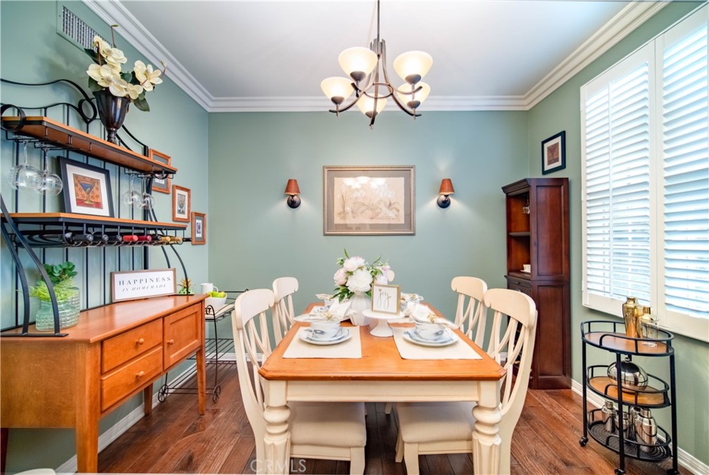 55 Bower Tree Irvine, CA 92603 - Photo 5 of 29 a view of a dining room with furniture wooden floor and chandelier