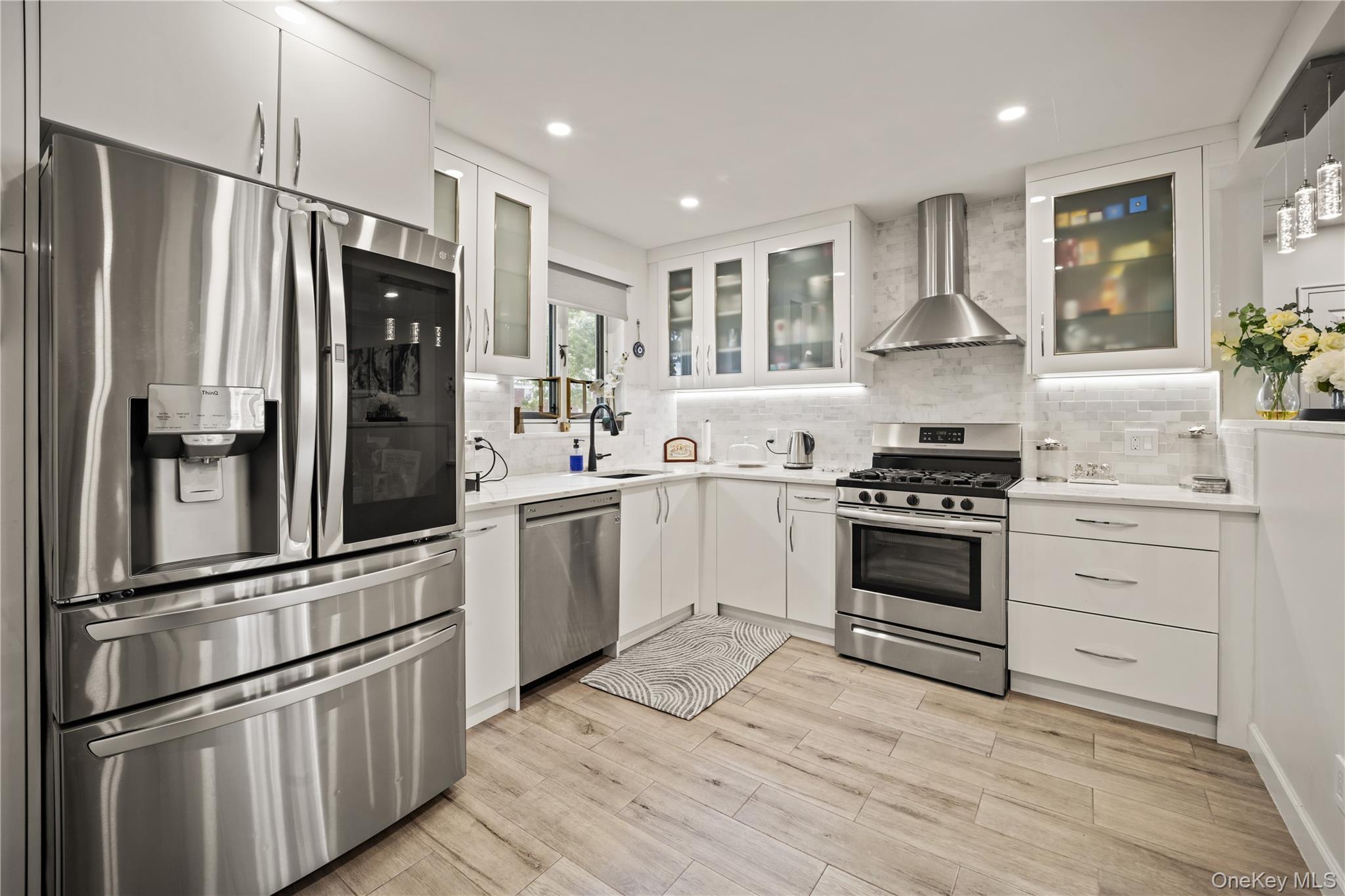 223-11 Manor Road, Unit UPPR Queens, NY 11427 - Photo 11 of 16 a kitchen with granite countertop a refrigerator stove and sink