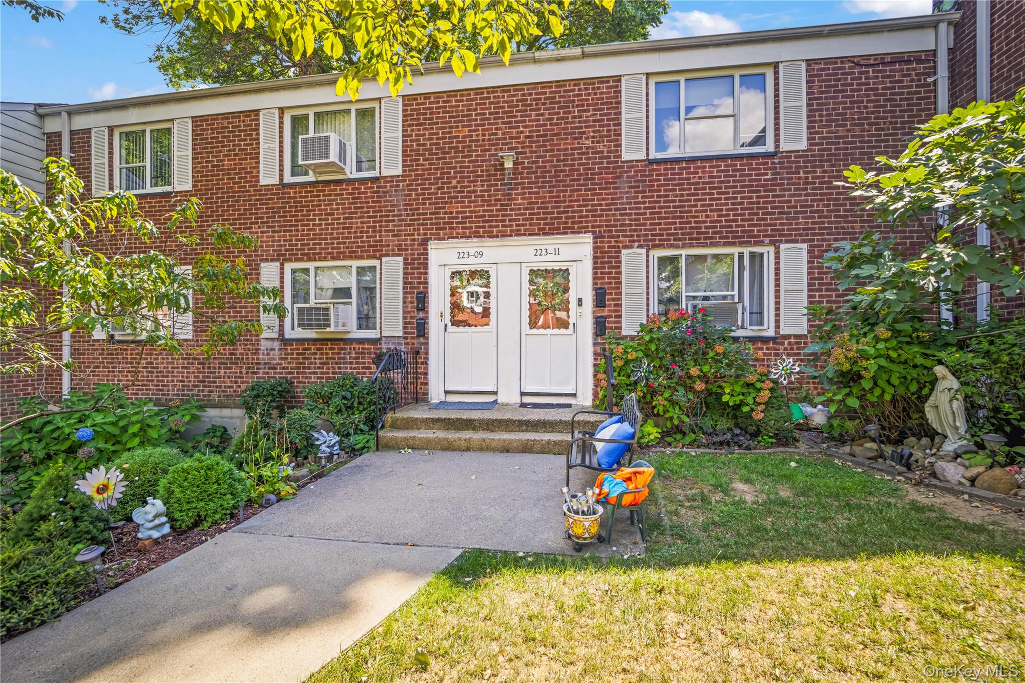 223-11 Manor Road, Unit UPPR Queens, NY 11427 - Photo 15 of 16 a view of outdoor space yard and front view of a house