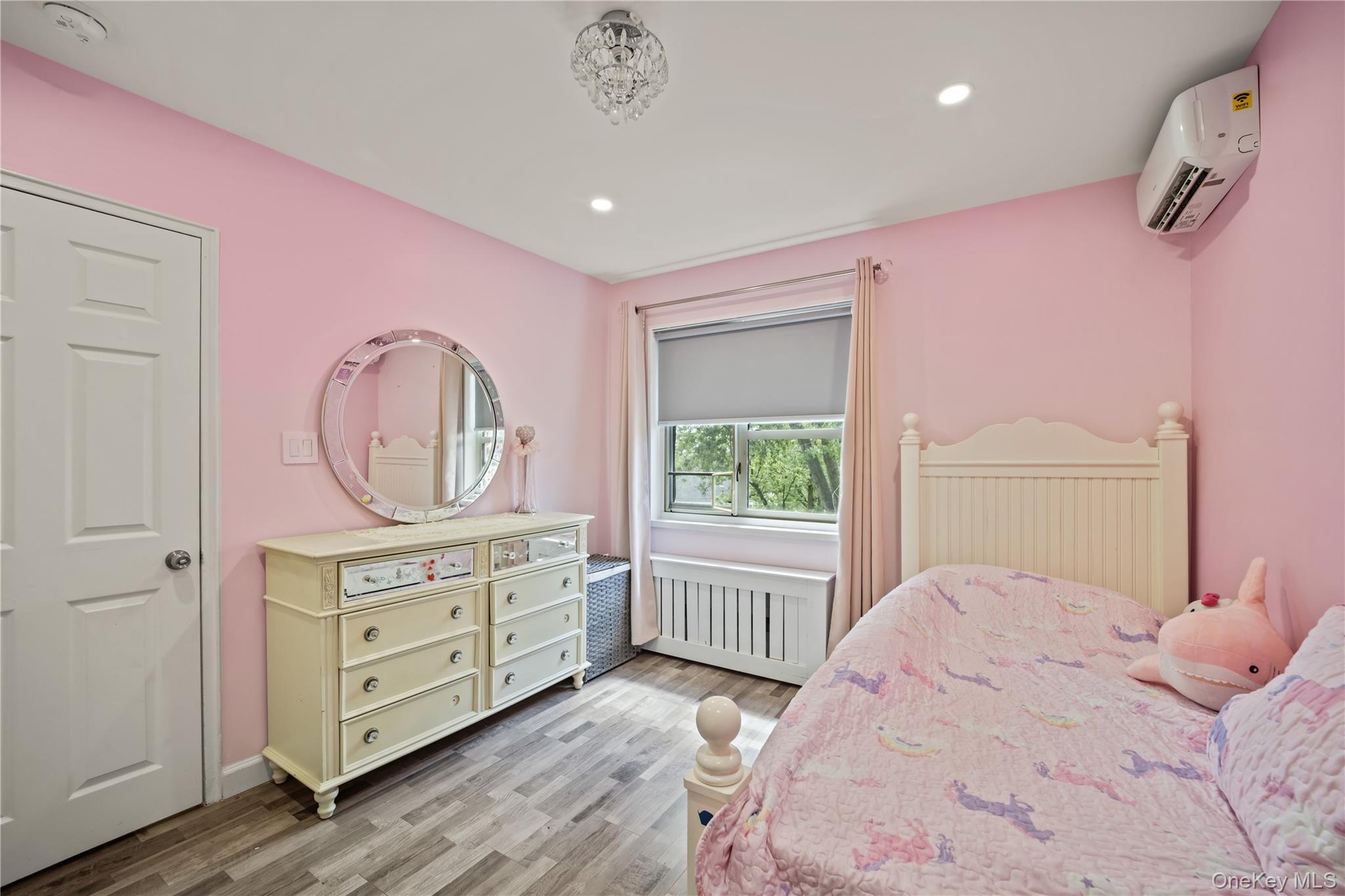 223-11 Manor Road, Unit UPPR Queens, NY 11427 - Photo 7 of 16 a bedroom with a bed and a dresser