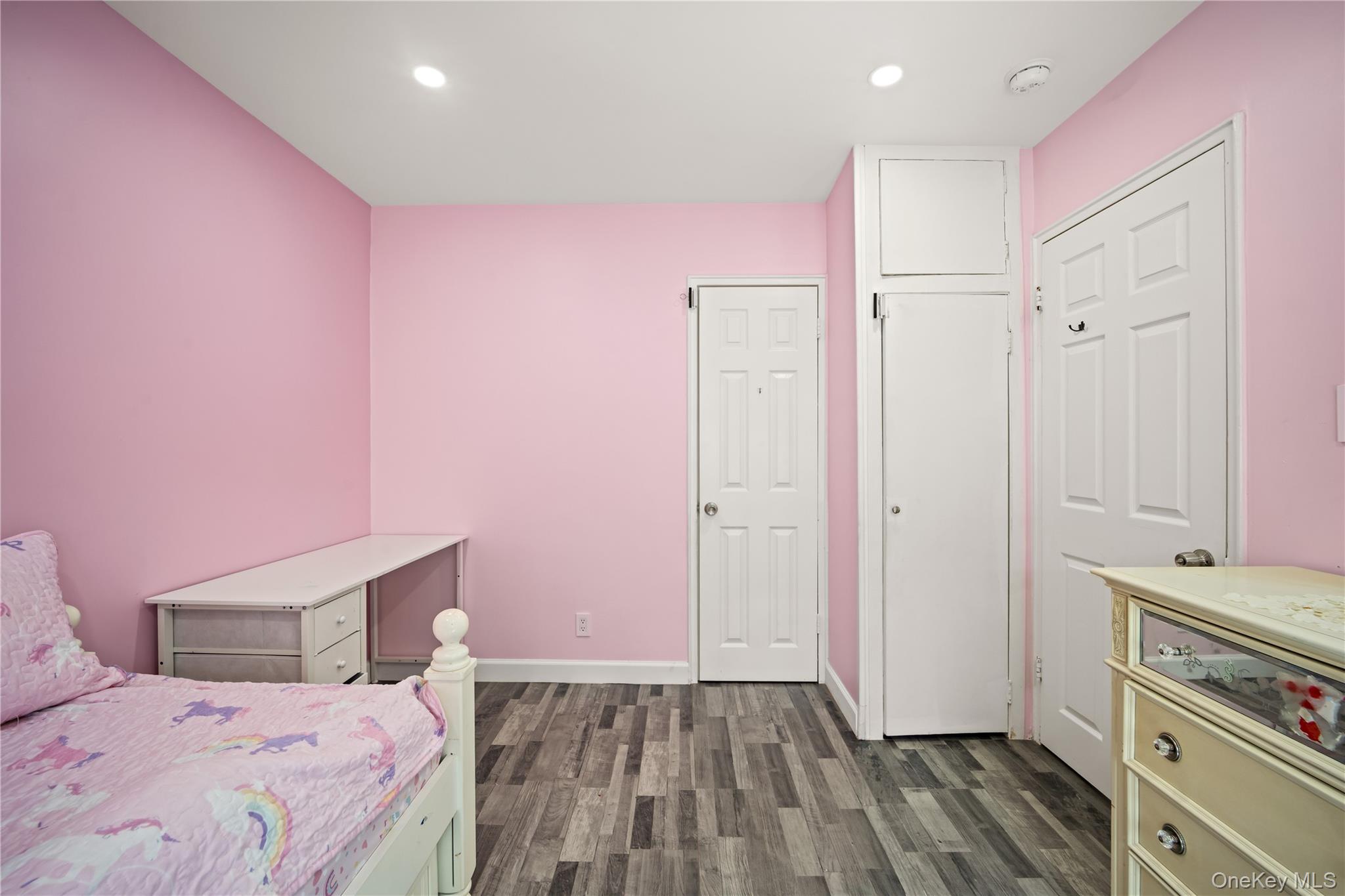 223-11 Manor Road, Unit UPPR Queens, NY 11427 - Photo 9 of 16 a bedroom with a bed and a dresser