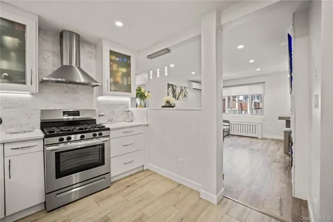 a kitchen with a stove and a refrigerator