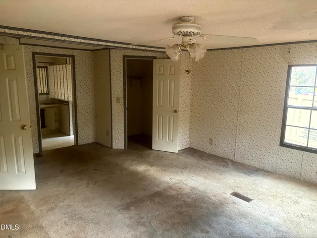 a kitchen with granite countertop a sink and a stove