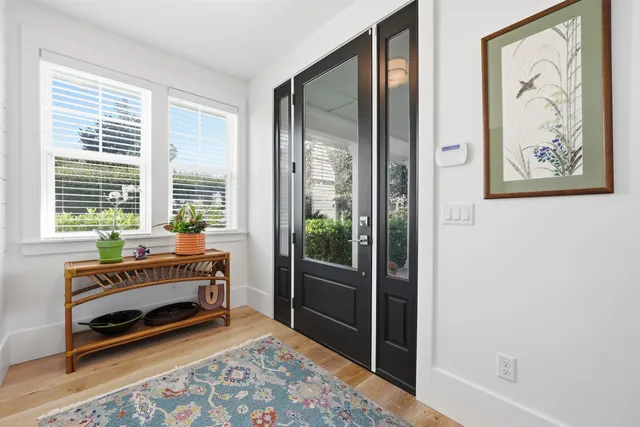 a view of a livingroom with furniture and wooden floor