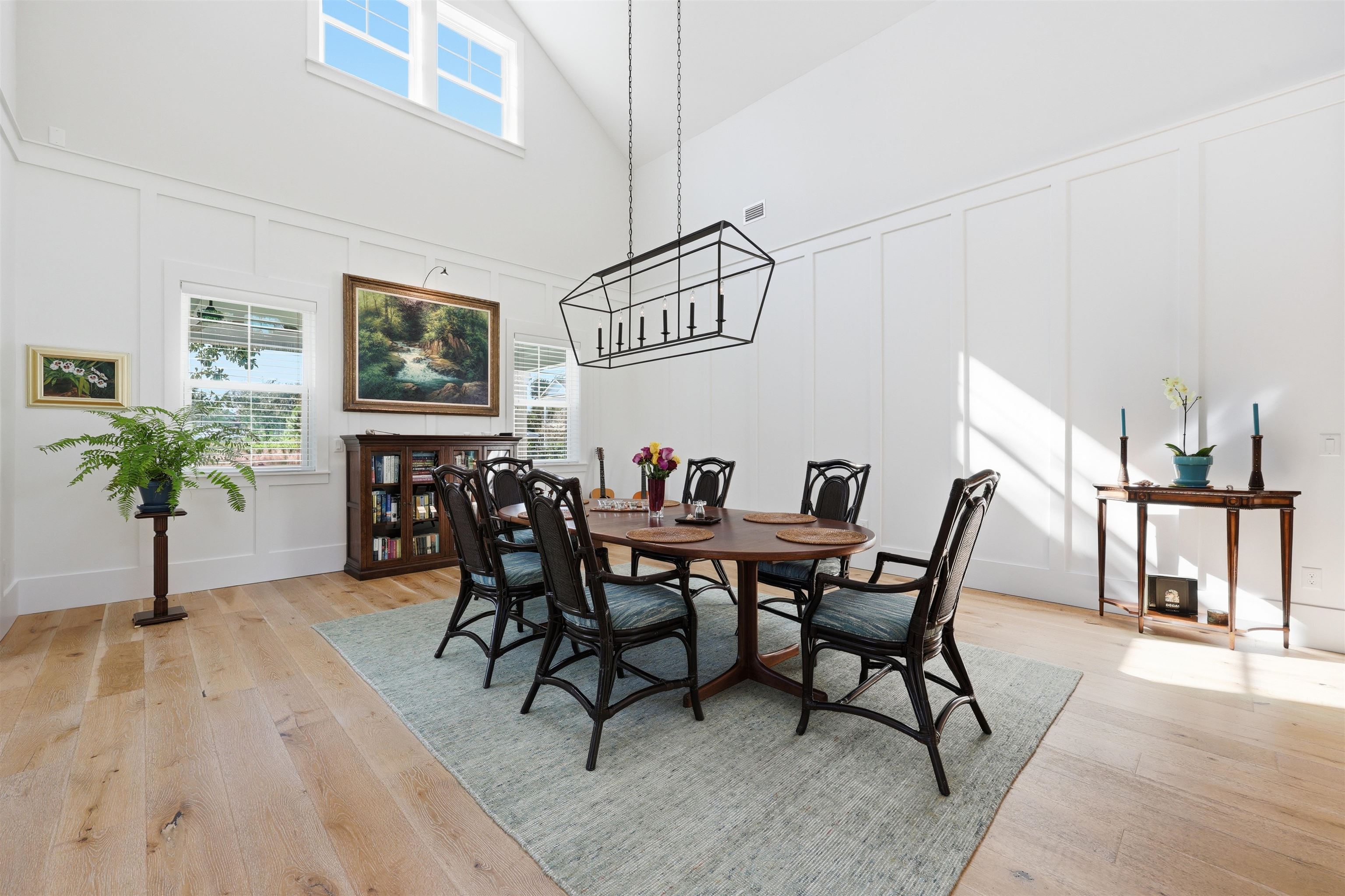 66 Ridgeway Road St. Augustine, FL 32080 - Photo 37 of 53 Dining room with a decorative wall, healthy amount of natural light, light wood-style flooring, high vaulted ceiling, and a chandelier