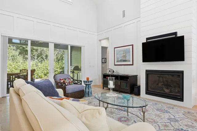 a room with furniture a window and a ceiling fan