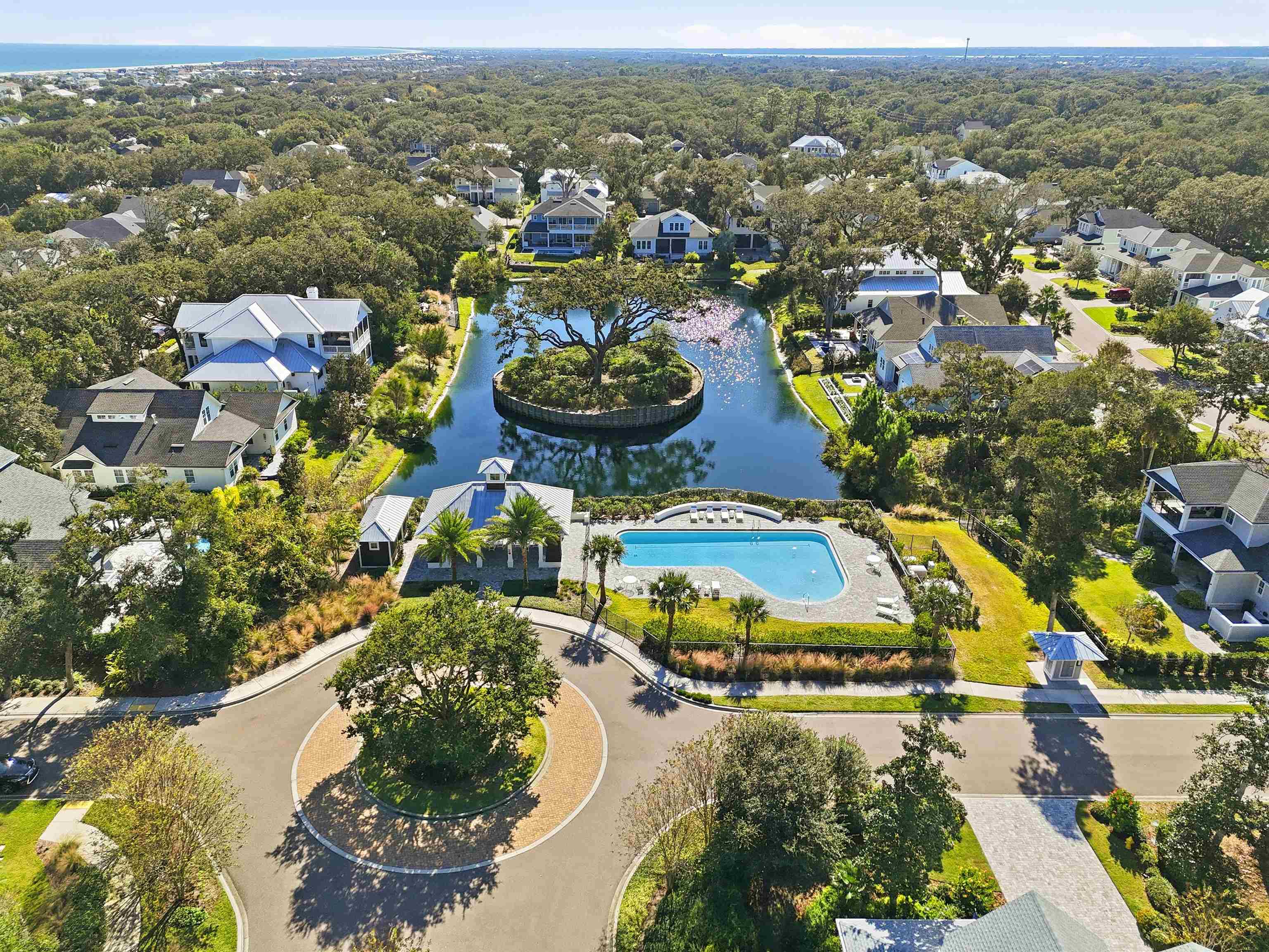 66 Ridgeway Road St. Augustine, FL 32080 - Photo 4 of 53 Aerial perspective of suburban area with a large body of water and a pool area