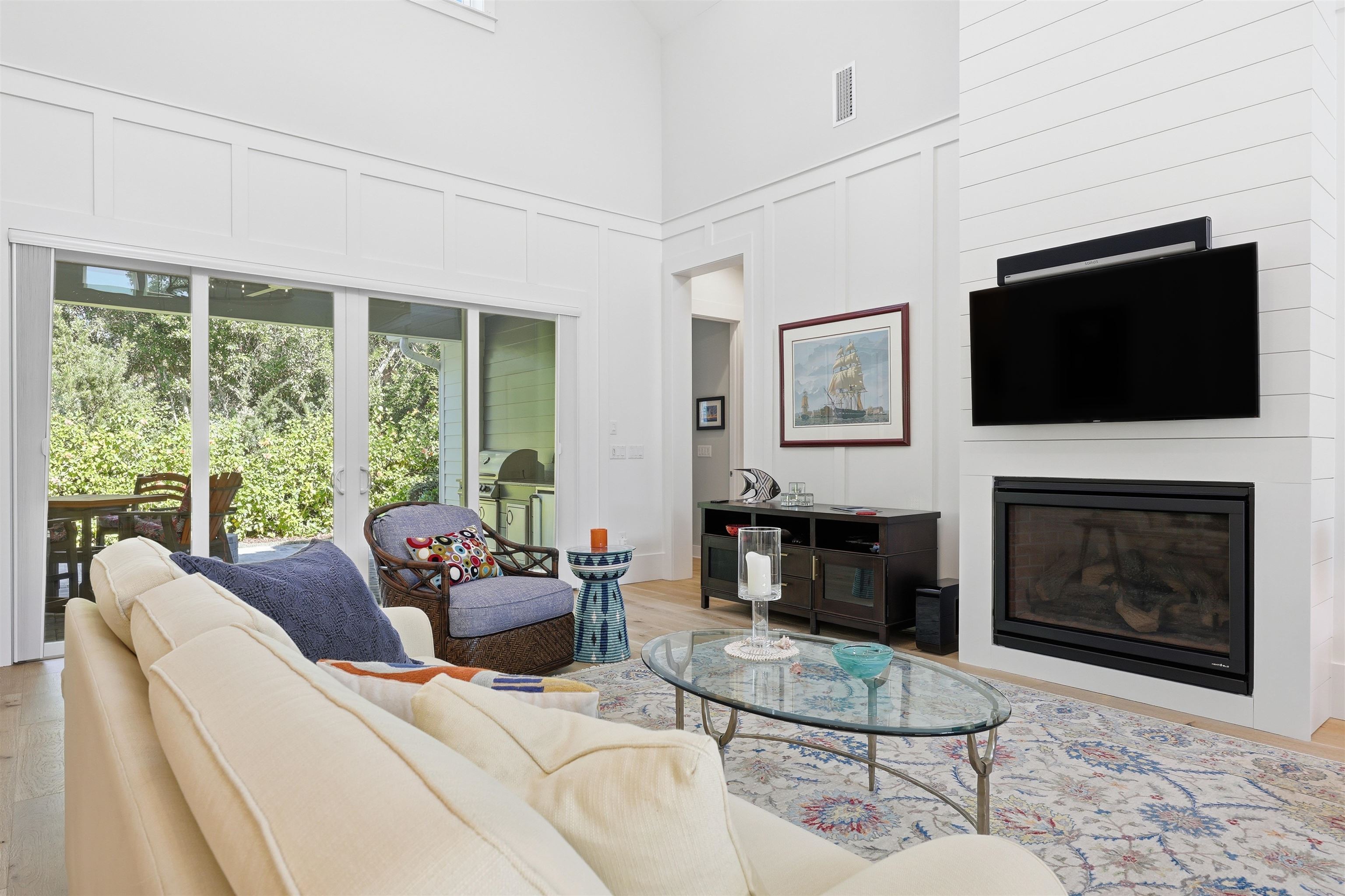 66 Ridgeway Road St. Augustine, FL 32080 - Photo 49 of 53 a living room with furniture a flat screen tv and a fireplace