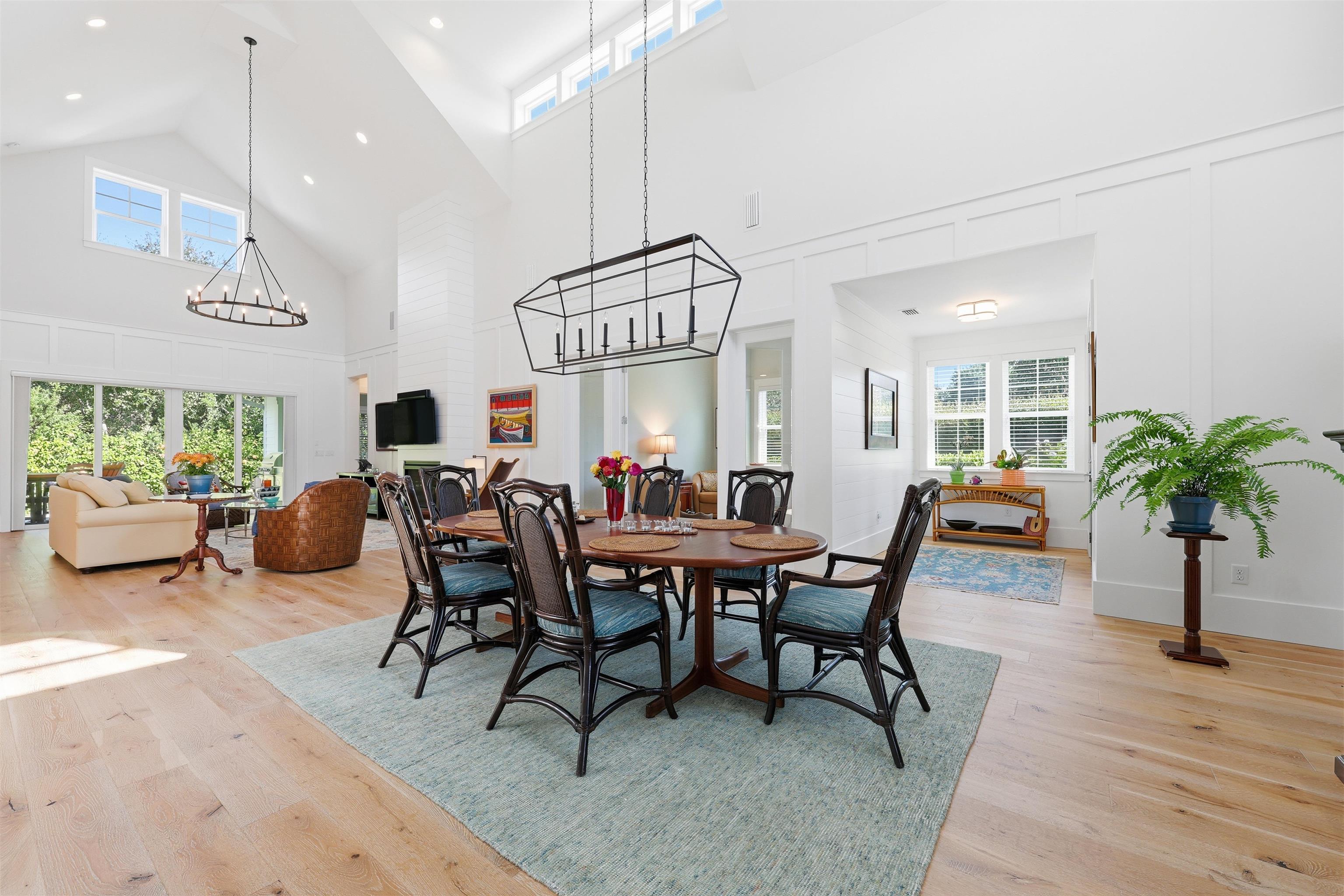 66 Ridgeway Road St. Augustine, FL 32080 - Photo 7 of 53 Dining area featuring high vaulted ceiling, plenty of natural light, light wood finished floors, and a chandelier