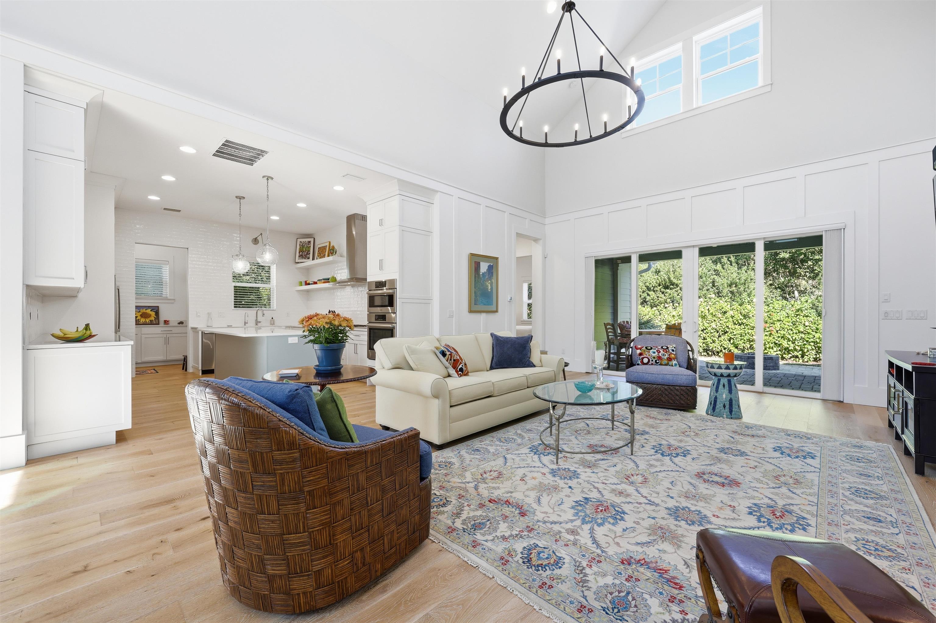 66 Ridgeway Road St. Augustine, FL 32080 - Photo 8 of 53 Living area with healthy amount of natural light, light wood-style flooring, a chandelier, and a high ceiling