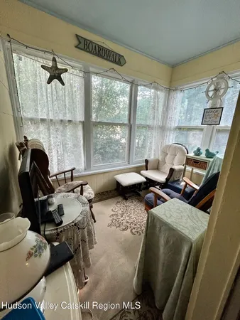 a gym room with furniture and a window