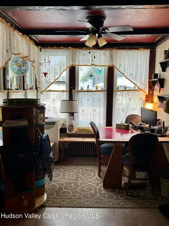 a room with lots of furniture and a rug