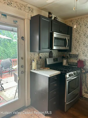 a kitchen with a stove and a microwave