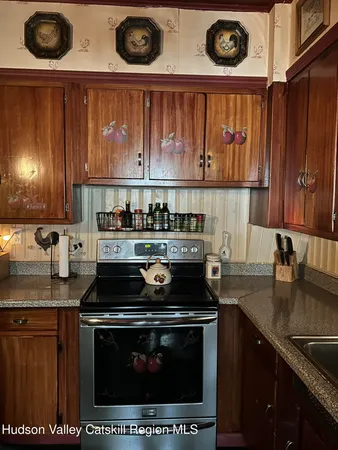 a kitchen with a stove and a sink