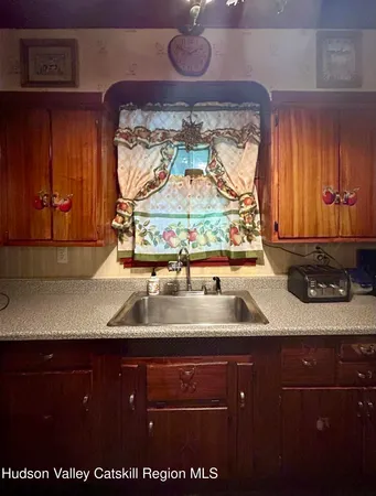 a kitchen with a sink and cabinets