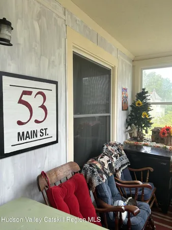 a bedroom with furniture and a potted plant