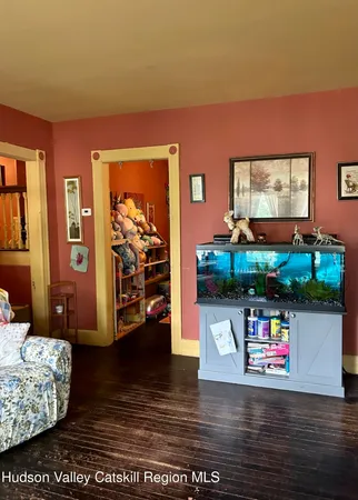 a view of living room with furniture and screen tv