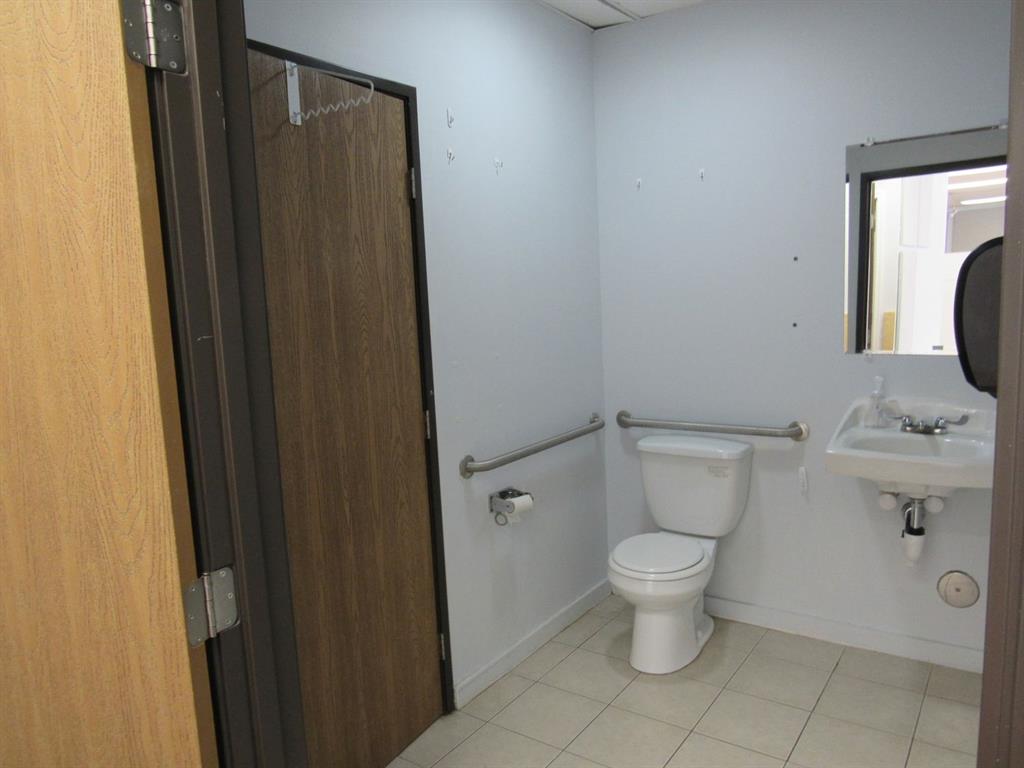3208 Lebanon Church Road West Mifflin, PA 15122 - Photo 8 of 11 a white toilet sitting next to a bathroom sink