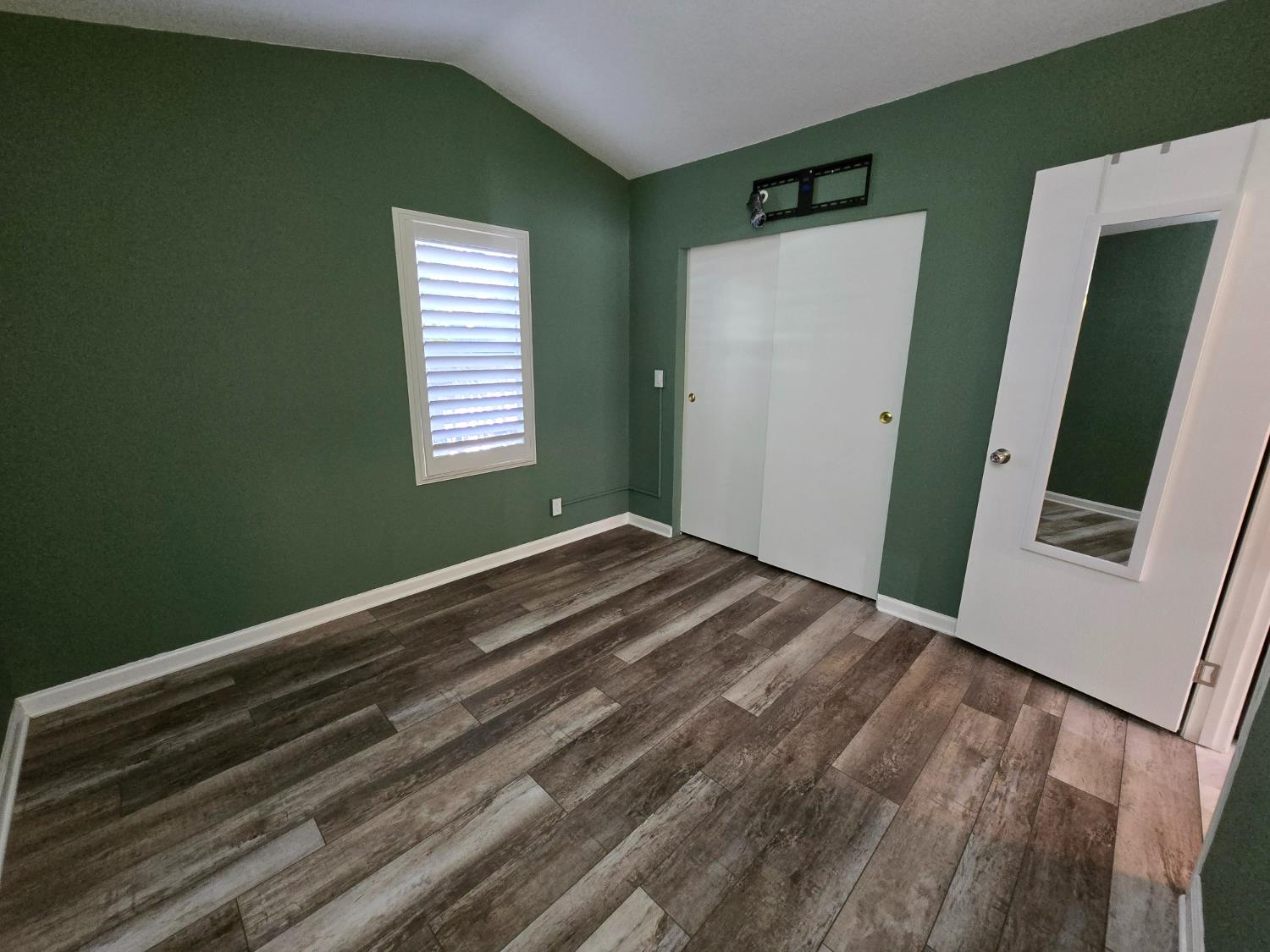 13955 West Walnut Grove Road, Unit 26 Walnut Grove, CA 95690 - Photo 18 of 29 a view of empty room with window and stairs