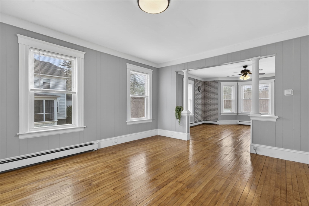 22 Maple Street Templeton, MA 01436 - Photo 10 of 28 a view of an empty room with wooden floor and a window