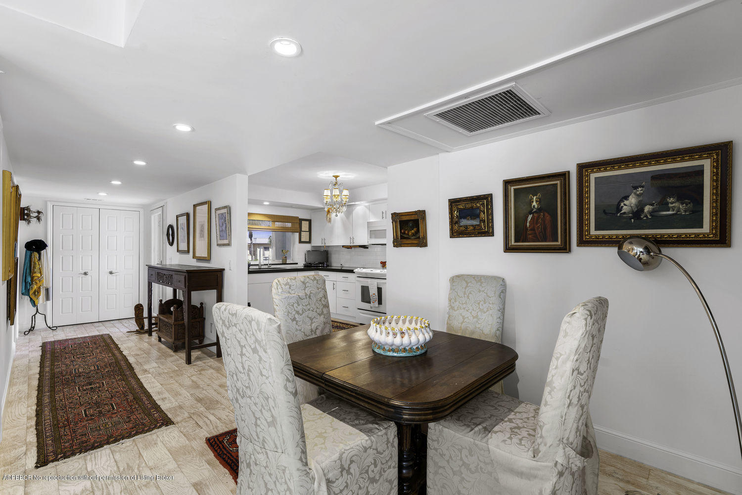 250 South Beach Road, Unit 208 Jupiter, FL 33469 - Photo 5 of 14 a view of a dining room with furniture and a rug