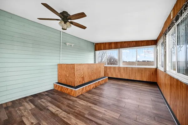 a view of front door with wooden floor