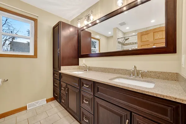 a bathroom with a bathtub and shower