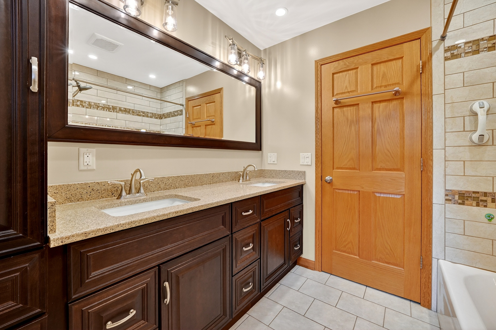 21230 Virginia Road DeKalb, IL 60115 - Photo 29 of 54 a bathroom with a granite countertop sink and a mirror