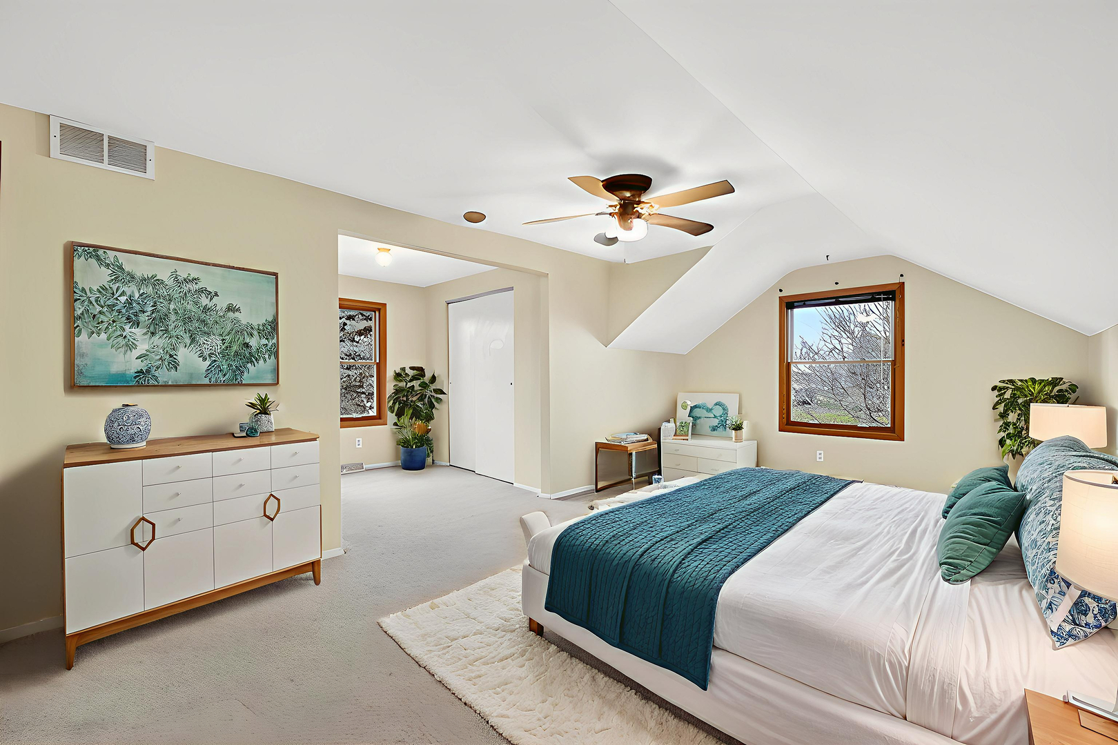 21230 Virginia Road DeKalb, IL 60115 - Photo 41 of 54 a bedroom with a large bed and a chandelier