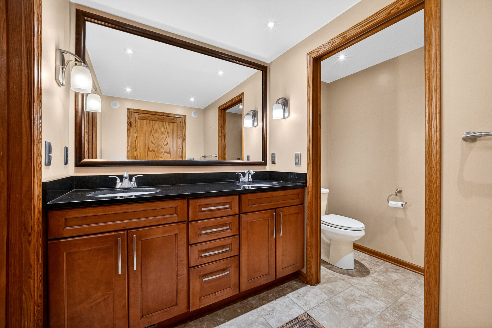 21230 Virginia Road DeKalb, IL 60115 - Photo 45 of 54 a bathroom with a sink a toilet and a mirror