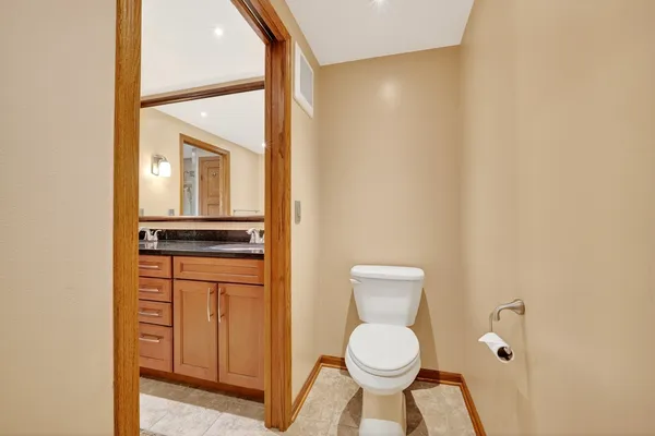 a bathroom with a tub and a window